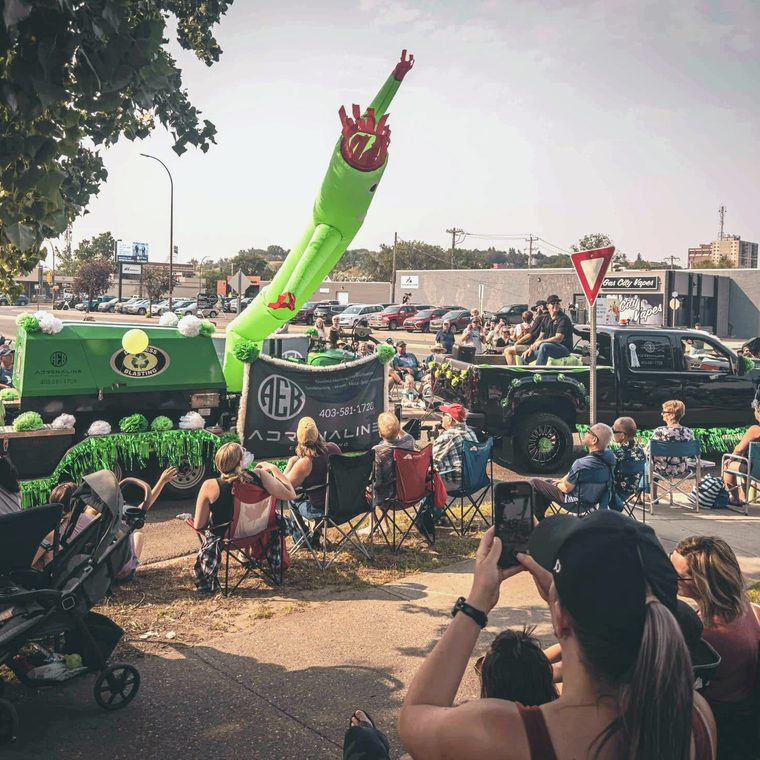 Adrenaline Eco Blasting in the Medicine Hat Stampede parade, crowd lining the street