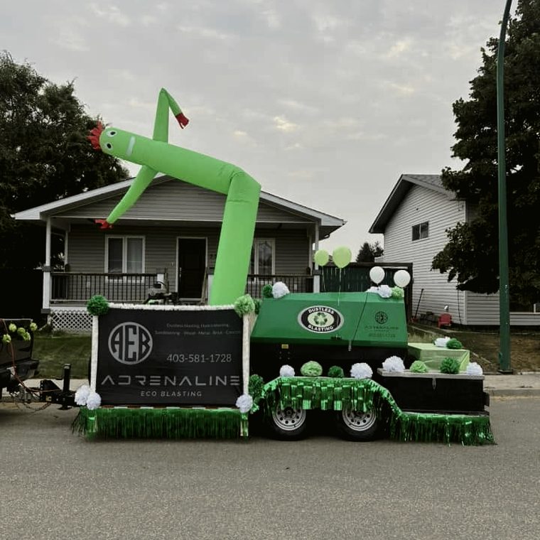 Side view of the Adrenaline Eco Blasting parade float in Medicine Hat