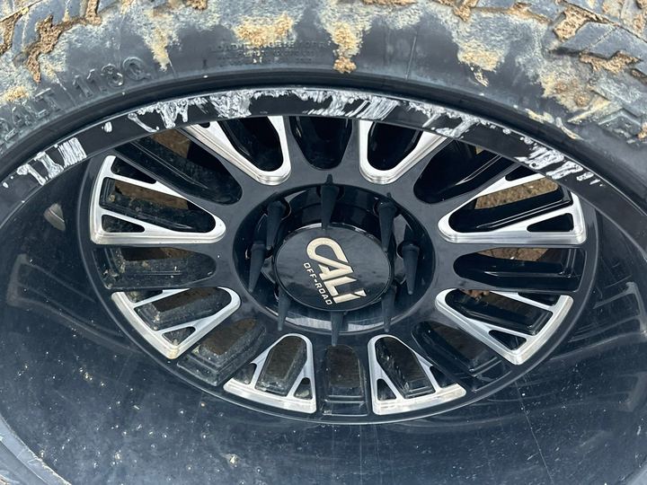 Wheel showing corrosion and brake dust before cleaning
