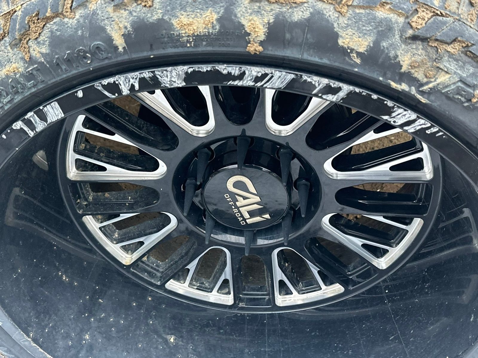 Wheel showing corrosion and brake dust before cleaning