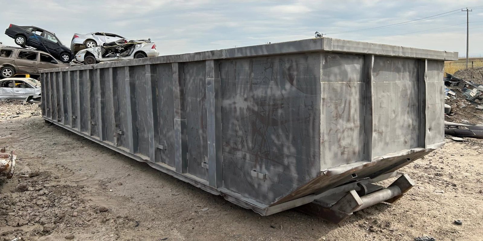 Roll-off waste bin stripped to sound steel