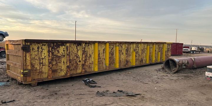 Roll-off waste bin stripped to sound steel