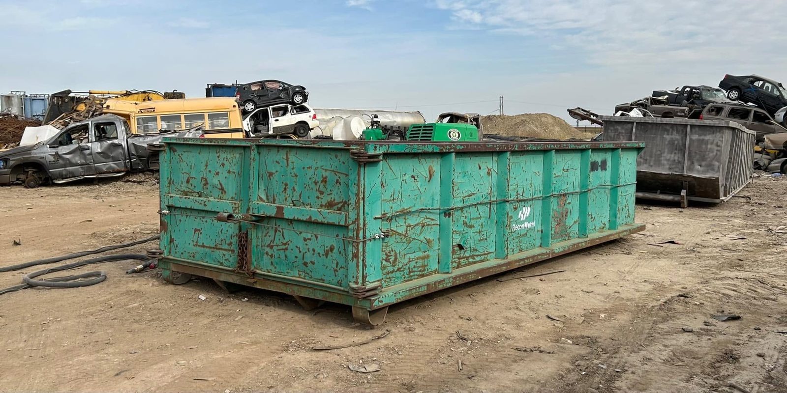 Roll-off waste bin stripped to sound steel