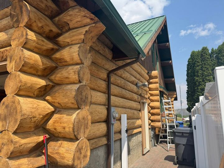 Log home exterior during restoration