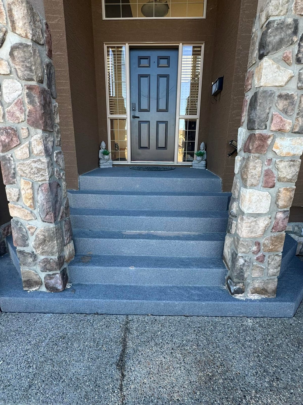 Stone and concrete entry steps after coating removal by blasting