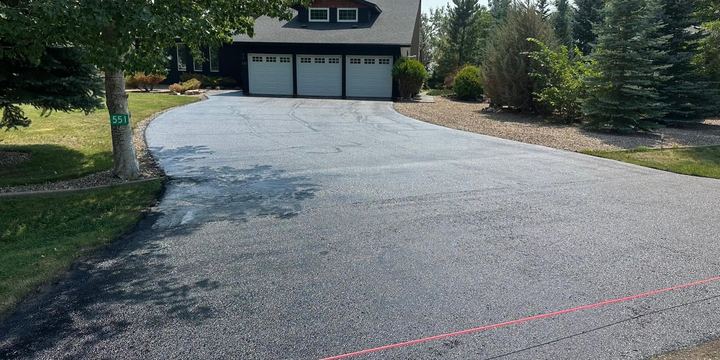 Asphalt driveway cleaned and sealed