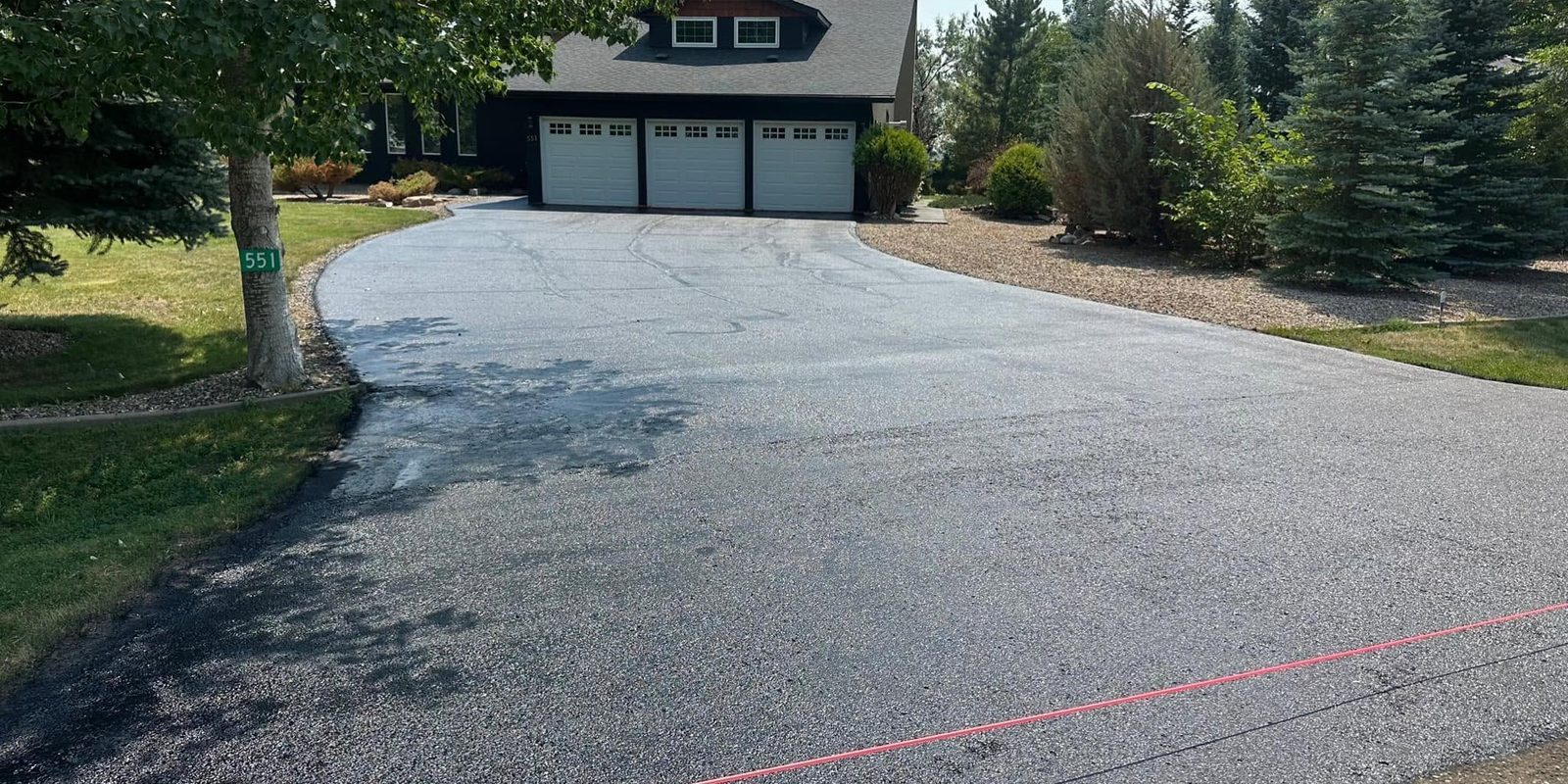 Asphalt driveway cleaned and sealed
